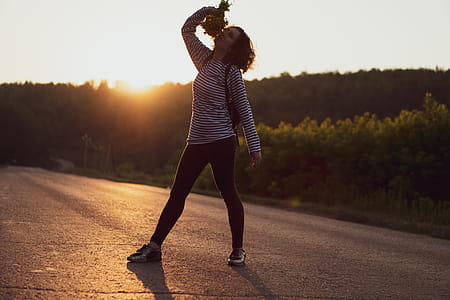 Woman Standing on Asphalt Road thumbnail