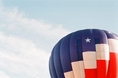 photo of blue, red, and white hot air balloon at daytime thumbnail