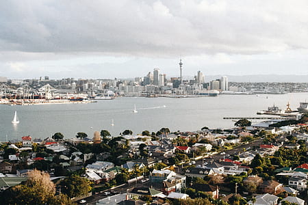 aerial shot of concrete structures near body of water thumbnail