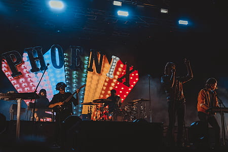 people performing on stage with lights thumbnail