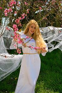 woman taking selfie near flowers thumbnail