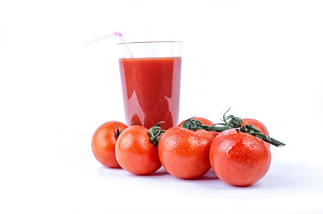 still life photography of four cherry tomatoes and juice served on clear glass thumbnail