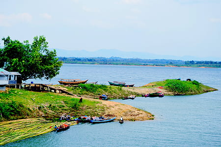 blue boat on body of water during daytime thumbnail