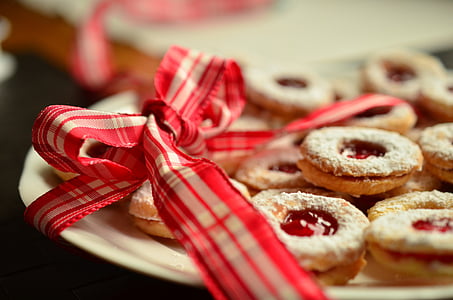 cookies with strawberry jam on white ceramic plate thumbnail
