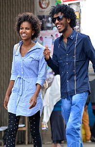woman in gray 3/4-sleeved shirt beside man in black button-up long-sleeved shirt during daytime thumbnail