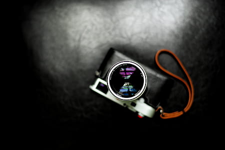 black and gray point-and-shoot camera thumbnail