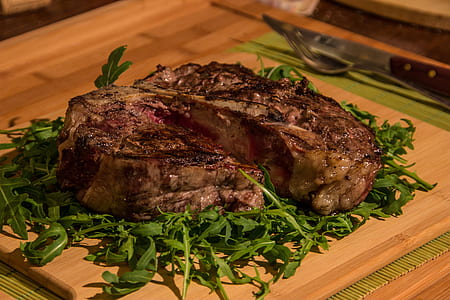grilled meat on top of brown tray thumbnail