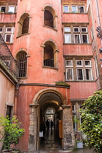 red concrete building near green leaf plant thumbnail