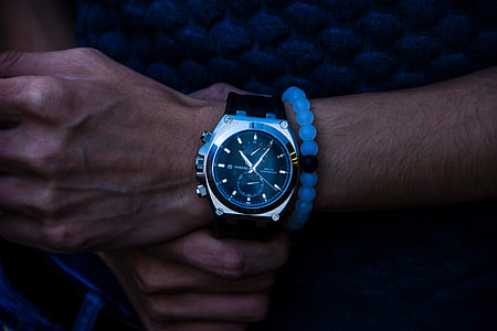 Closeup shot of a man wearing a wrist watch thumbnail