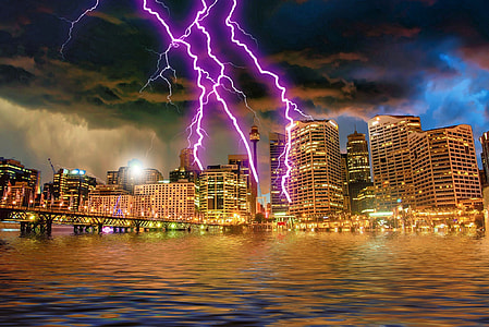 city near body of water under lighting thumbnail