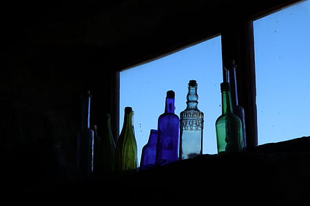 silhouette photography of glass bottles thumbnail