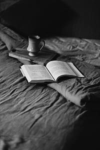 open book near ceramic mug thumbnail