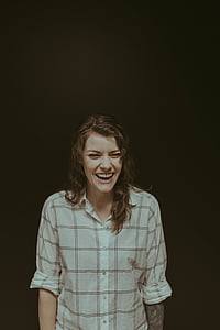 smiling woman wearing white dress shirt thumbnail