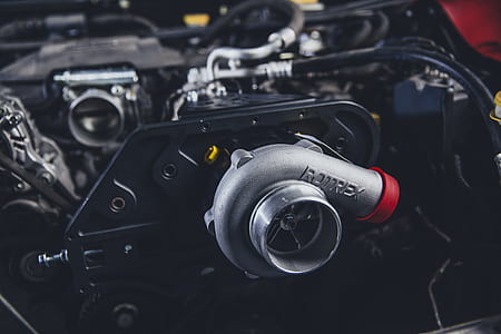 selective focus photography of gray Rotrex turbocharger thumbnail