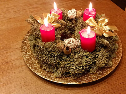 four red candles on brown plate thumbnail
