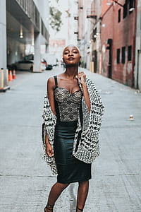 woman holding shawl standing on concrete road thumbnail