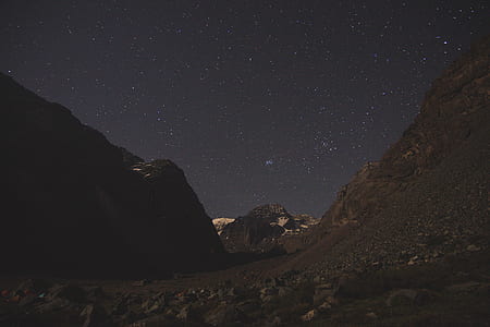 rocky mountain under starry sky thumbnail