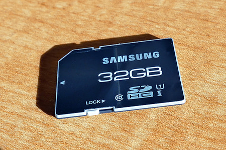 blue Samsung 32 GB adapter on brown surface thumbnail