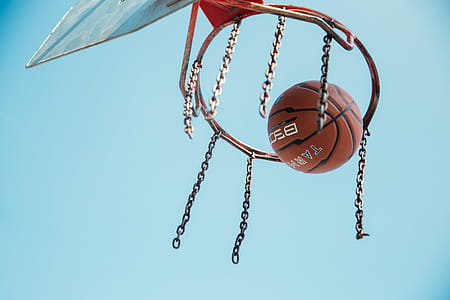 Basketball in basketball net in the day time thumbnail