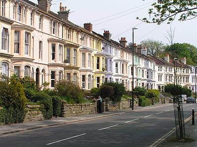 white and beige houses near road thumbnail