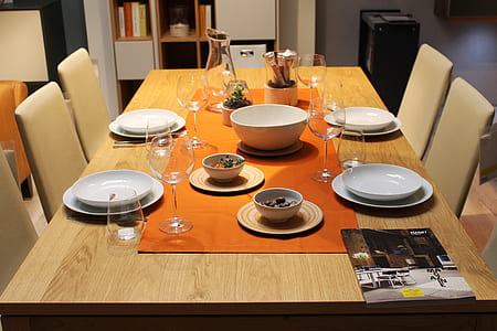 white ceramic dinnerware set on rectangular brown wooden dining table thumbnail