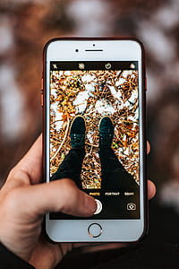 person holding rose gold iPhone 6s Plus thumbnail