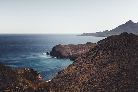 sea on foot of mountain thumbnail