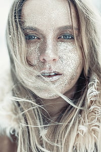 woman's face covered with white dust thumbnail
