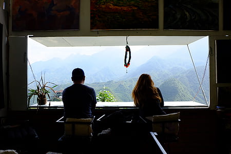 couple looking through window thumbnail