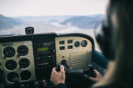 person driving plane at daytime thumbnail