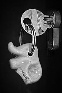 grayscale photo of gray key in lock thumbnail