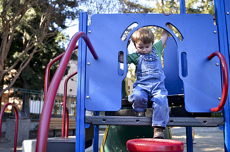 toddler standing on playhouse thumbnail