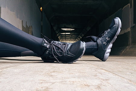 person wears black Under Armour shoes thumbnail