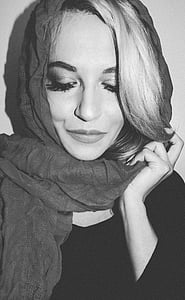 woman holding and wearing headscarf thumbnail