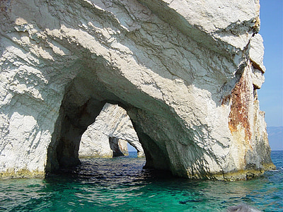 white concrete tunnel on body of water thumbnail