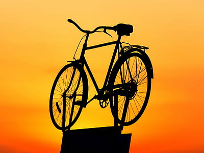 silhouette photography of bicycle during sunset thumbnail