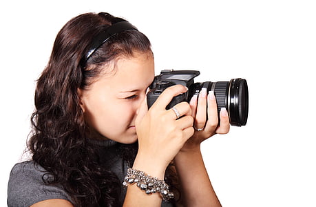 woman holding black DSLR cameroa thumbnail
