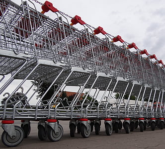 photo of gray steel shopping cart lot during daytime thumbnail