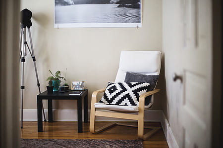 gray and black camera tripod on brown wooden floor thumbnail