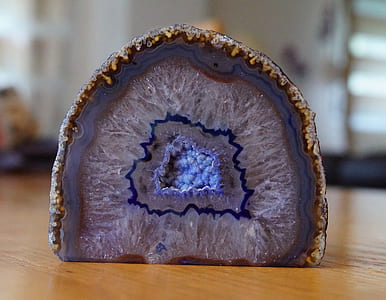 blue geode on brown wooden table thumbnail