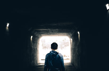 man standing in tunnel thumbnail