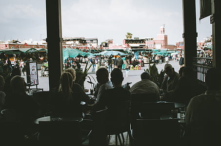 Silhouette Photo of People Sitting on Chairs thumbnail