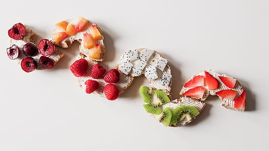 Assorted Sliced Fruit Lot on White Surface thumbnail