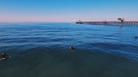 man riding surfboard on blue ocean thumbnail