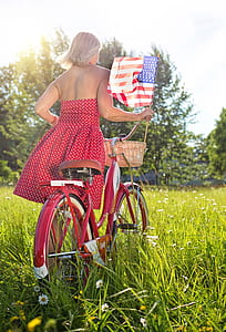 woman with bike, red, bicycle, bike, american flag, fourth of july thumbnail