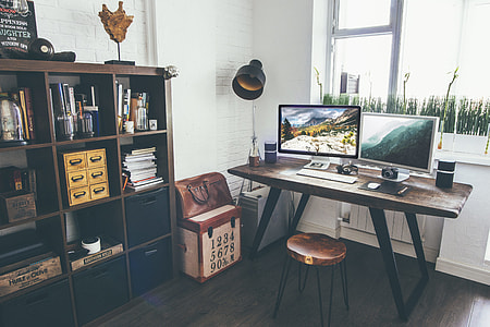 brown wooden desk near cube organizer thumbnail