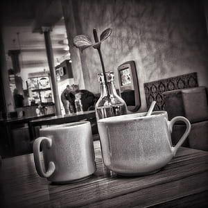 grayscale photo of two ceramic mugs thumbnail