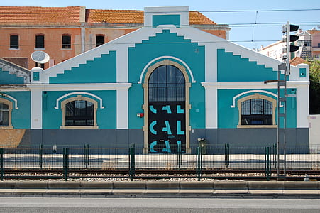 teal and white concrete house thumbnail