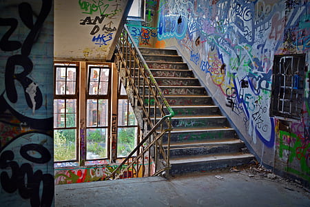 Graffiti Wall With Wrought Iron Donwstairs thumbnail