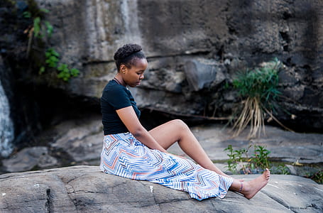 woman sitting on rock thumbnail